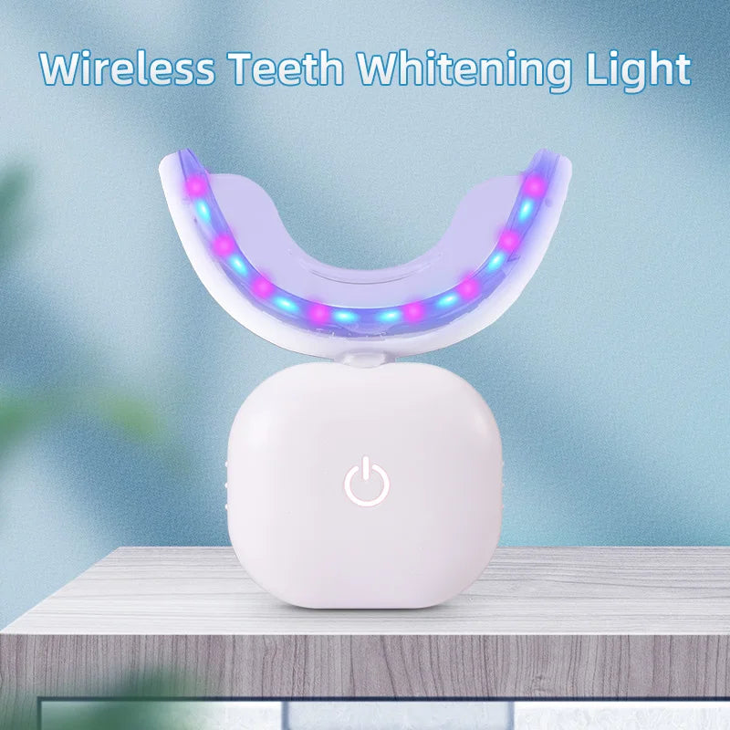 Genvita Pro wireless teeth whitening light device with LED blue and red lights on a wooden surface