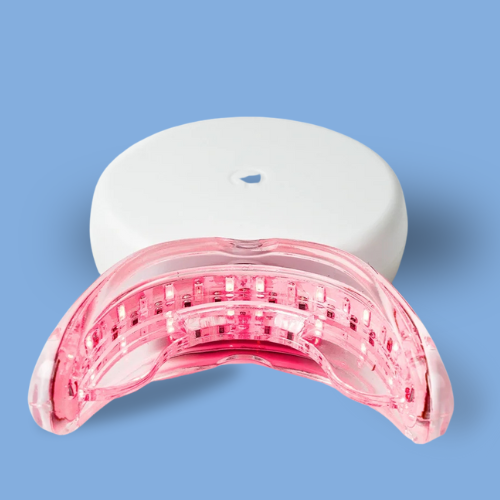 Genvita Pro teeth whitening LED light device with white charging case on blue background