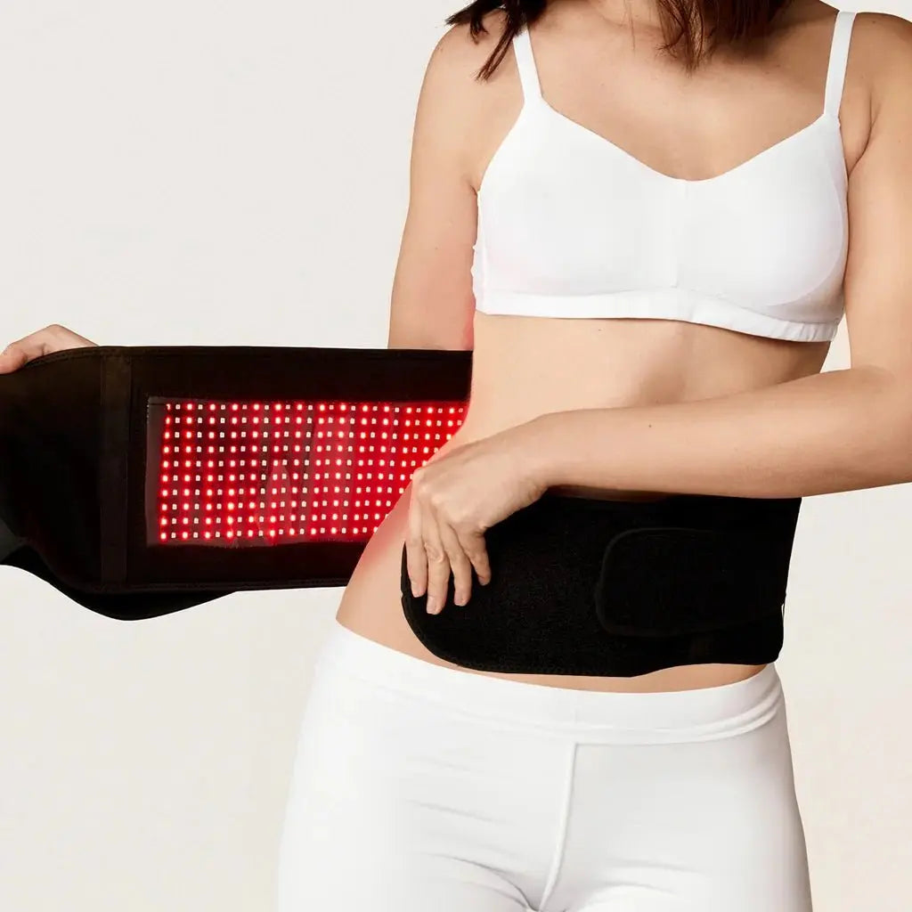 BodiBeam Belt with red light therapy worn around waist.